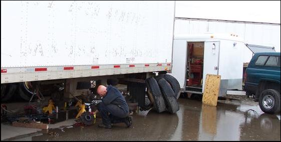 Locky in the rain installing new bearings and brakes