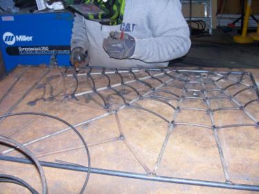 Andrew making crystal's window bars